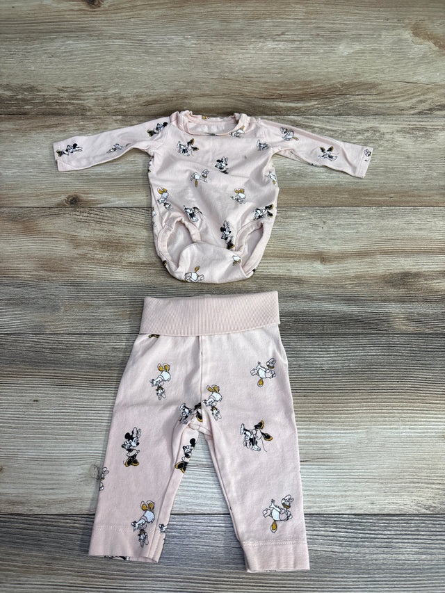 Light pink baby long sleeve bodysuit and matching pants set with Minnie Mouse print on wooden floor