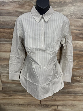 Striped button-up maternity blouse with tie waist and long sleeves on wooden background