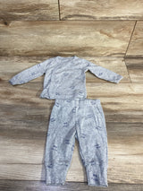 Flat lay of grey kimono top and elastic-waist pants set with navy 'Love you' and 'Little one' print on wood background