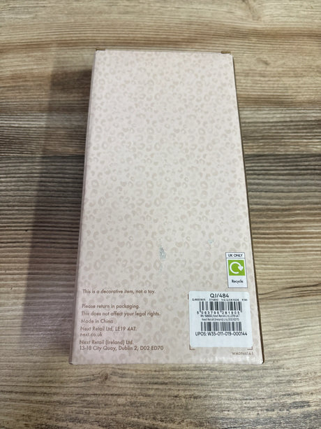 Back view of NEW Next Baby Safari wooden clothes dividers 7pk packaging showing beige leopard print design on a wood surface