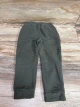 Lee drawstring joggers in green for toddlers size 3T on a wooden background