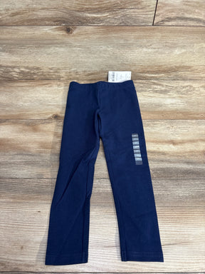 Navy blue toddler leggings with size tags on wood background, gently used kids clothing