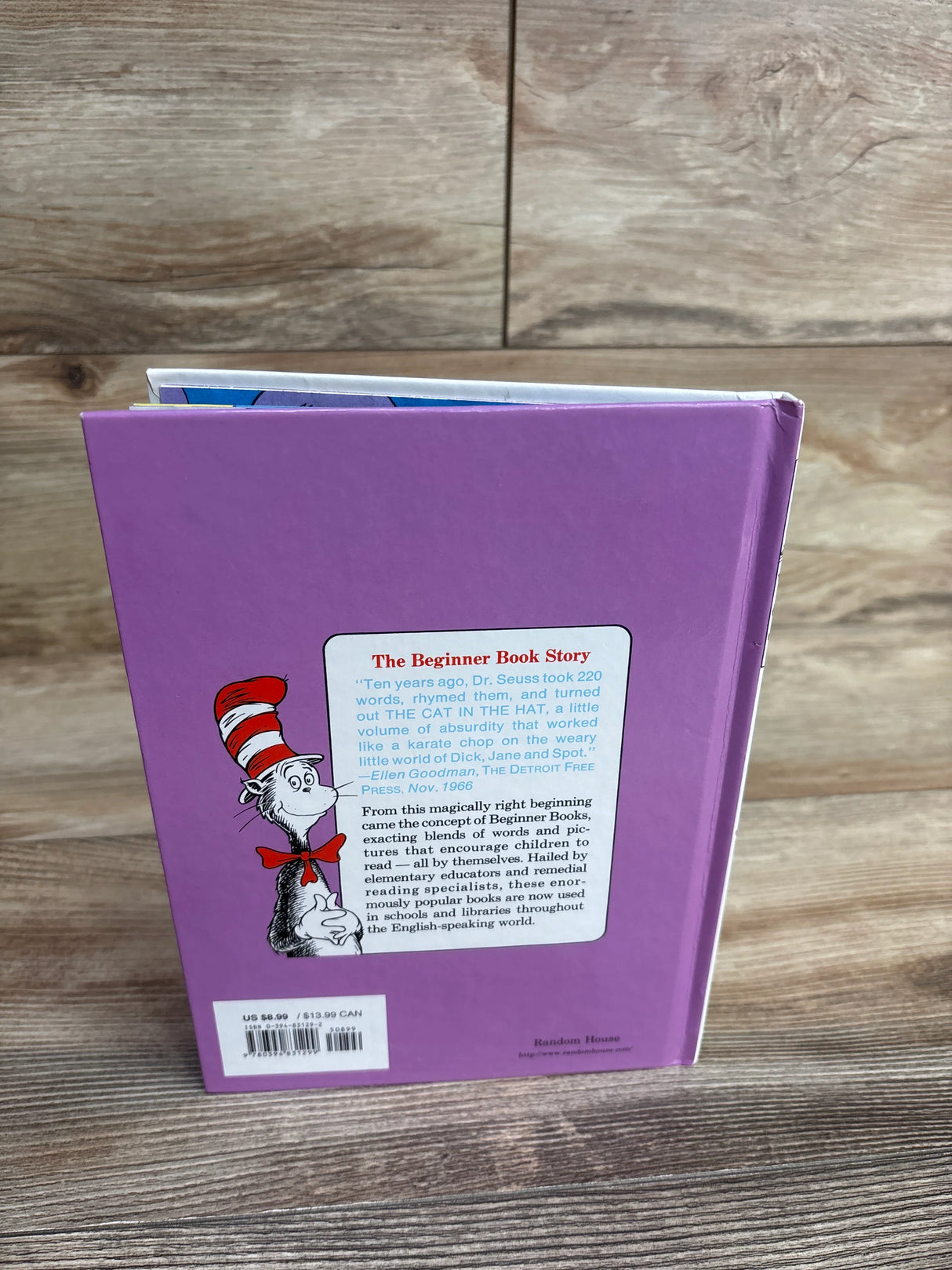 Back cover of a purple Dr. Seuss children's book with the Cat in the Hat illustration and a story description