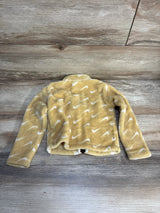 Soft yellow kids fleece jacket with white swoosh pattern, laid flat on wood floor