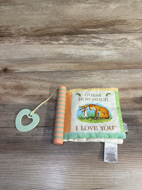 Soft baby book with teether, Guess How Much I Love You cover illustration on wood background