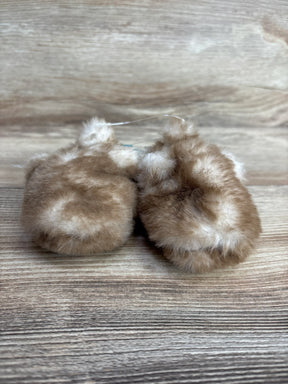 Soft and fluffy brown baby mittens on wood background for children's resale store
