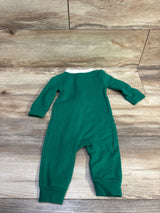 Green Nike collared zip coverall for infants in size 6m laid on a wood surface