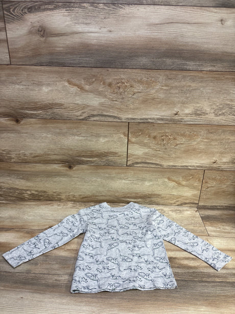Front view of Little Me grey long sleeve shirt in size 3T showcasing an allover dinosaur print on a wood plank background