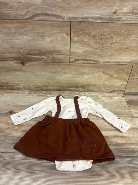 Flat lay of Carter’s 2pc Long Sleeve Bodysuit and Skirtall Set showcasing ivory leaf-print bodysuit and brown skirtall