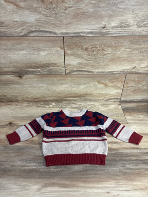 Red and navy geometric pattern toddler sweater on wood background, kids resale clothing