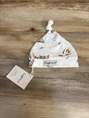 Flat lay of Snuggle Hunny koala organic knotted beanie showcasing knotted top, koala print and brand label on wood surface