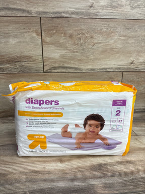 Package of Up & Up size 2 diapers with SuperAbsorb channels featuring baby on changing pad