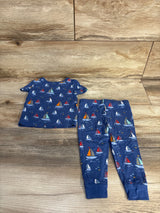 Front flat-lay of Little Me 2-piece bamboo pajama set in blue with sailboat print and cuffed pant ankles on wood backdrop