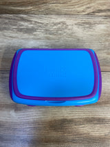 Blue and purple plastic storage box on wood surface, labeled hand2mind, kids toy organizer