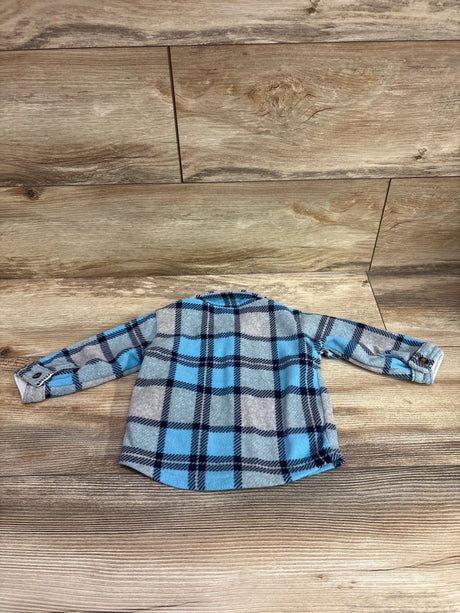 Carter's blue and grey plaid fleece button-up shacket for infants on a wood background