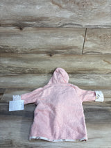 Back view of newborn pink hooded bath robe 0-9 months showcasing terry cloth texture and floral-trimmed cuffs on wooden plank background