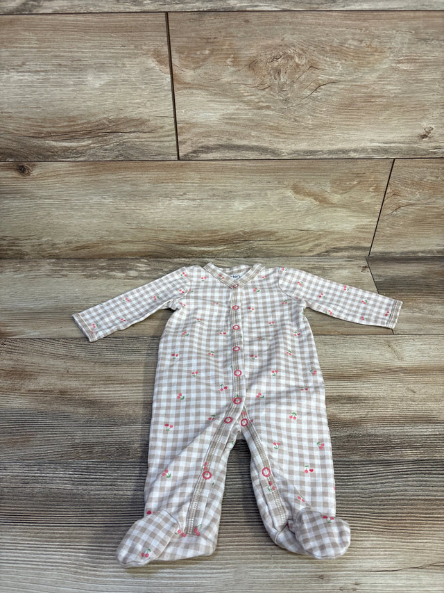 Flat lay of Carter's beige gingham baby sleeper with cherry print, front snap closure and built-in footies on wood background