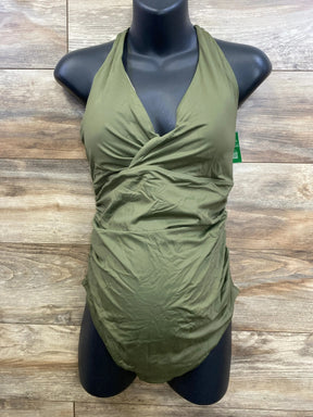 Front view of maternity one-piece wrap V-neck swimsuit in green with ruched sides on black mannequin against wood background