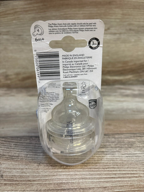 Front view of Philips Avent 2-pack anti-colic fast-flow nipples showing clear silicone design and 6m+ label on wood tabletop