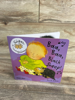 Front of Sign and Singalong board book 'Baa Baa Black Sheep', purple cover with child and black sheep on wood