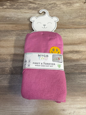 Pink NYGB TW baby wrap and hat set with smiley face patch, eco-friendly packaging on wood surface