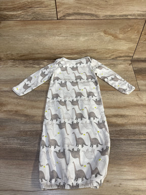 Flat-lay of Simple Joys white newborn (0-3M) gown with gray dinosaur print and elastic bottom on wood background