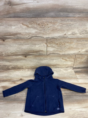 Navy blue zip-up hoodie with front pockets on wooden floor background