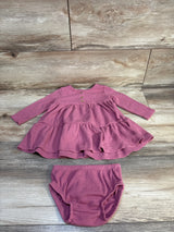 Mauve ribbed long sleeve baby dress with matching diaper cover on wood background