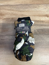 Child's camo pattern winter mitten with black cuff and product information label on wooden surface