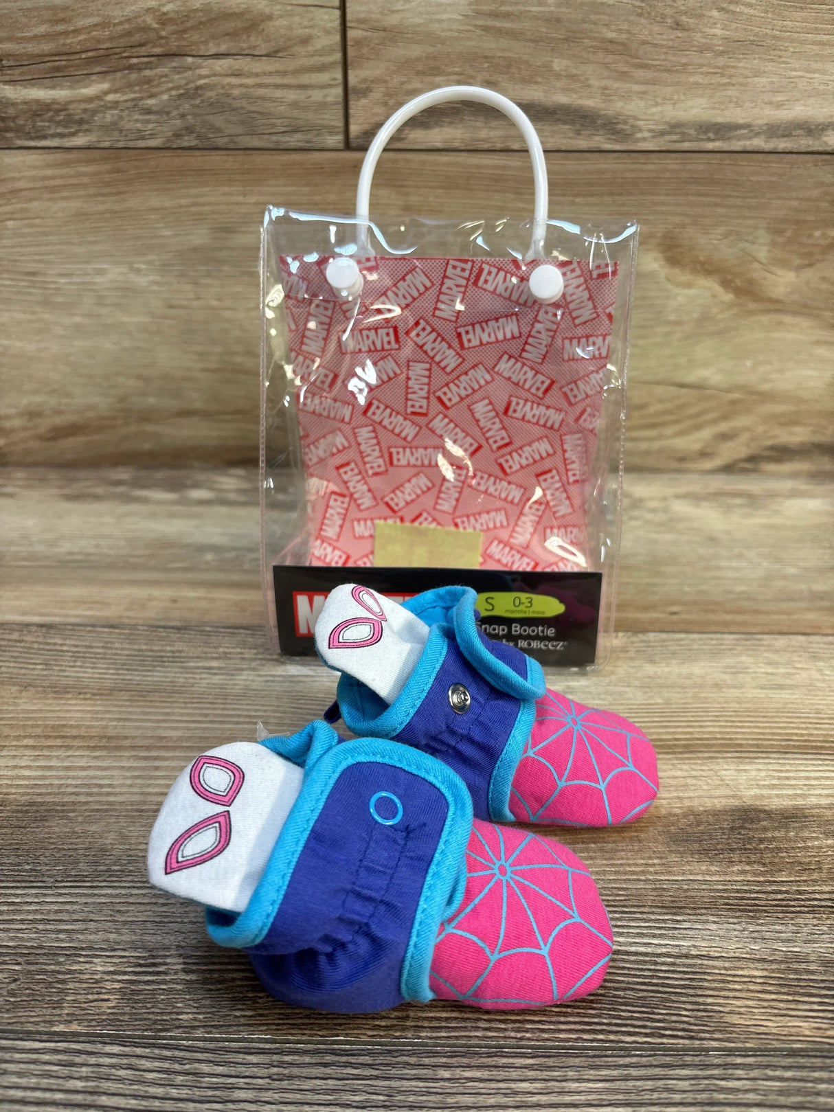 Spider-Man themed baby snap booties with pink web design and blue accents, size 0-3 months