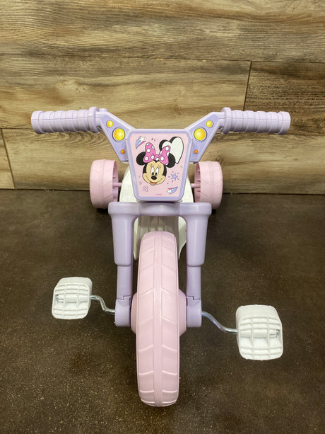 Front view of Minnie Mouse 10-inch Fly Wheels Cruiser Tricycle showcasing pink and lavender design with Minnie Mouse panel on a wood floor