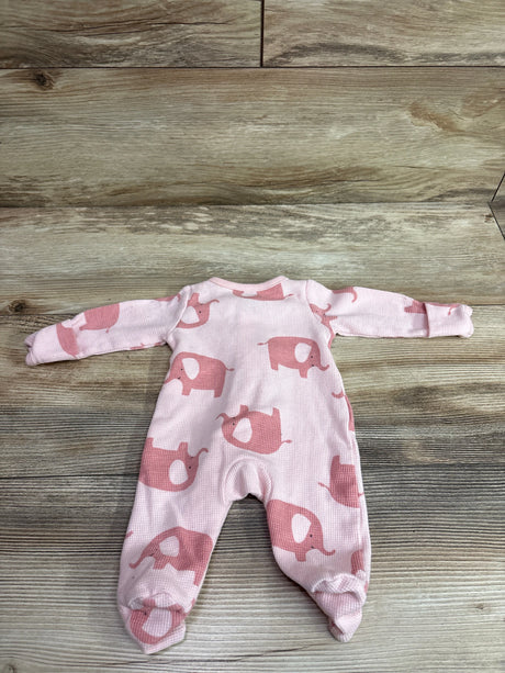 Flat lay of a pink Simple Joys waffle knit sleeper showcasing elephant print, long sleeves, and footed legs on a wood background