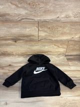Black kids Nike hoodie with white logo, long sleeves, front pouch pocket on wood background