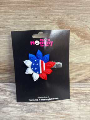 Front view of NEW Fourth of July ribbon hair bow with red white and blue flag petals on branded display card