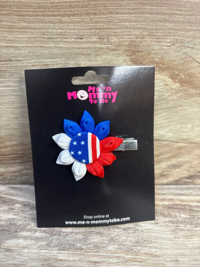 Front view of NEW Fourth of July ribbon hair bow with red white and blue flag petals on branded display card