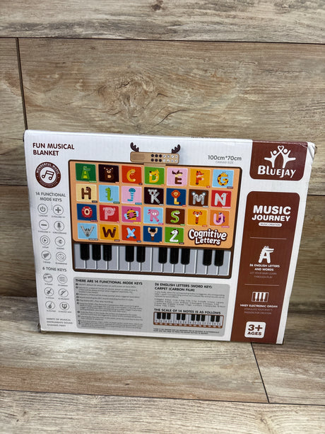Front view of BlueJay animal electronic piano mat box showing colorful alphabet squares and keyboard graphic on wood floor
