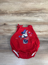 Flat lay of Disney Baby American Darling Minnie Mouse Bubble Romper in red showcasing patriotic Minnie graphic with shoulder tie straps on wood plank floor