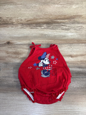 Flat lay of Disney Baby American Darling Minnie Mouse Bubble Romper in red showcasing patriotic Minnie graphic with shoulder tie straps on wood plank floor
