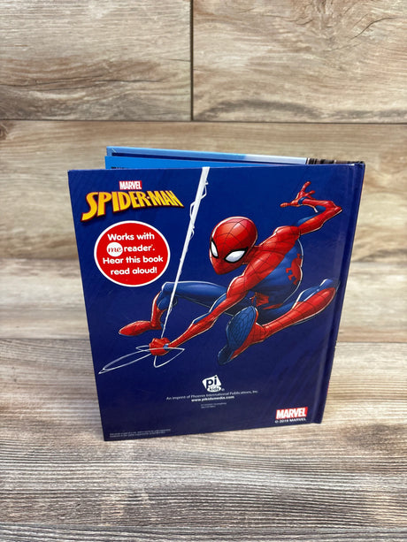 Front view of Marvel Spider-Man hardcover book showing Spider-Man and a red Works with me reader badge on wood tabletop
