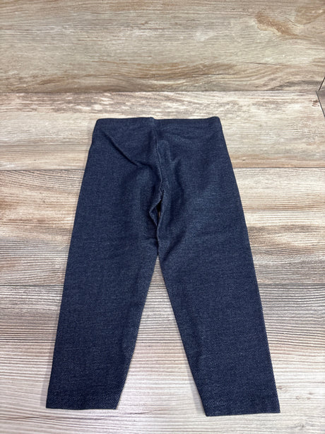 Navy blue Cat & Jack leggings for toddlers size 2T on a light wood background