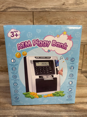 Front of Fishboy ATM Piggy Bank box showing toy ATM keypad, card slot, bill slot and play money on wood background
