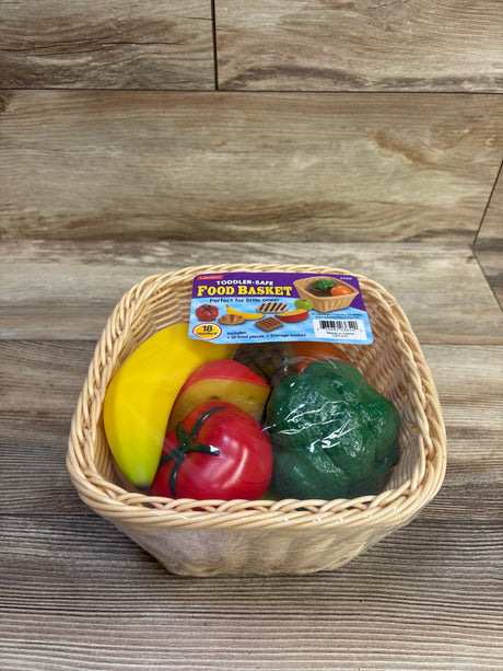 Front view of NEW Lakeshore Toddler-Safe Food Basket showcasing toy food pieces and woven storage basket on a wood surface