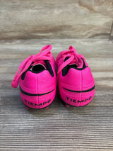 Bright pink Tiempo kids soccer cleats with black accents, perfect for young athletes