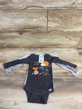 Long sleeve baby bodysuits with woodland animal print on wood background, gently used kids clothes