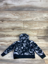 Back view of toddler Adidas pullover sweatshirt in grey and black camo showcasing attached hood and ribbed cuffs on wood background
