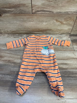 Front view of Carters orange striped footed sleeper in size 3 months showcasing a whale applique and front zipper on a wood-look floor