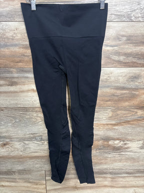 Black high-waisted maternity leggings displayed on wooden background