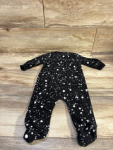 Front view of Nike black blanket sleeper in size 6 months with white speckled pattern and long sleeves on a wood floor