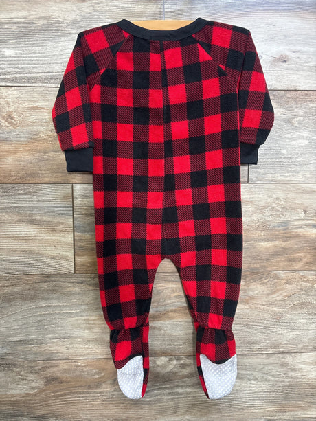 Front view of FollowMe blanket sleeper in red and black buffalo plaid showcasing long sleeves and footed legs with textured non-slip soles on a wood floor background