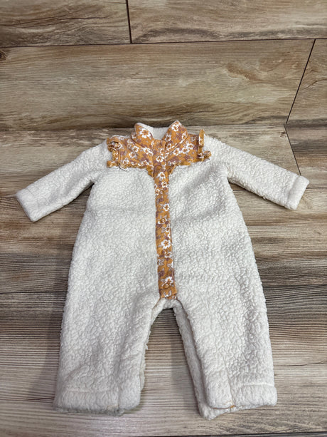 Front view of Nicole Miller sherpa coverall showcasing white sherpa fabric and brown floral trim on the collar and closure